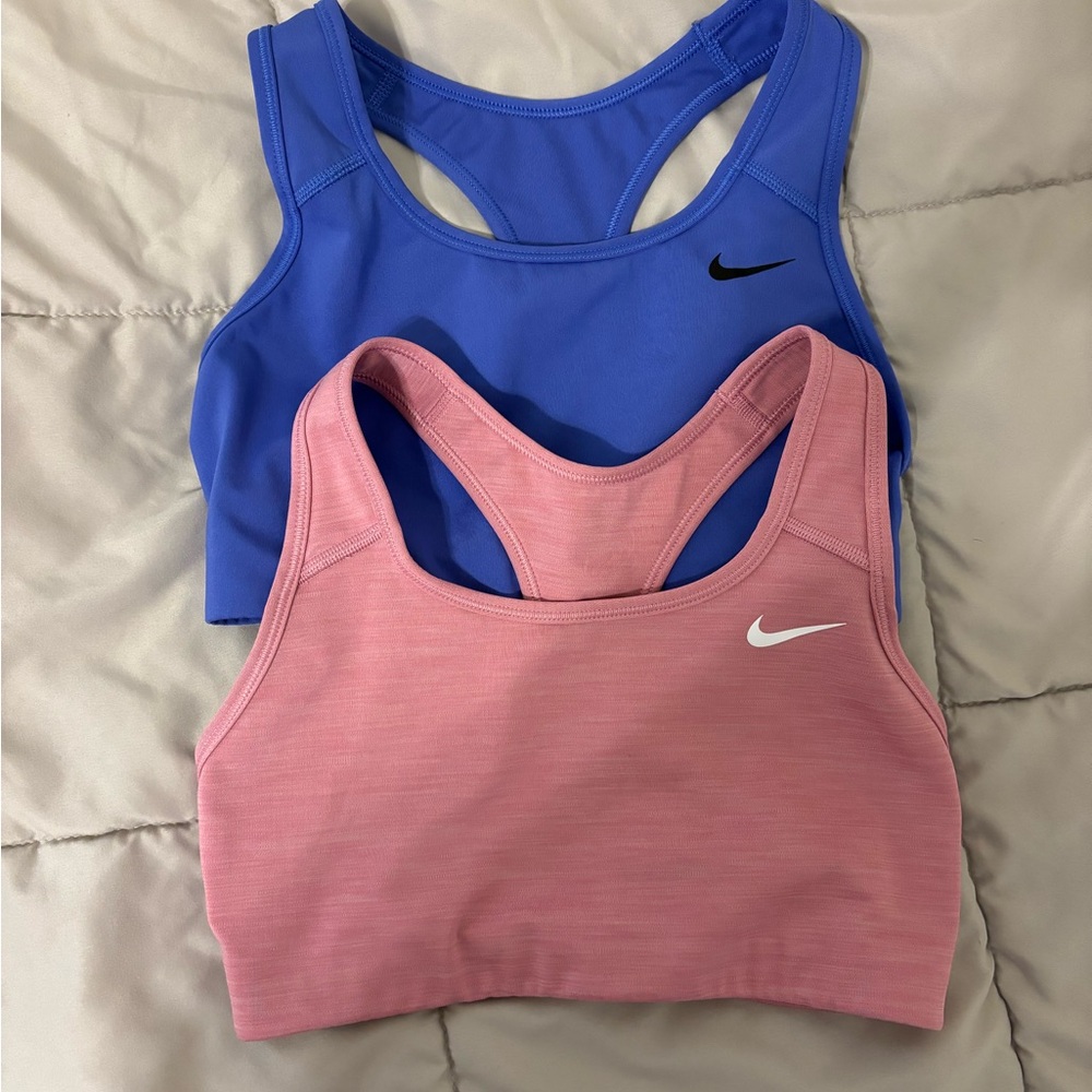 Two Nike sports bras purple and pink size small